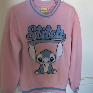 Disney Pink Top with Yellow Stitch Label and Blue Logo